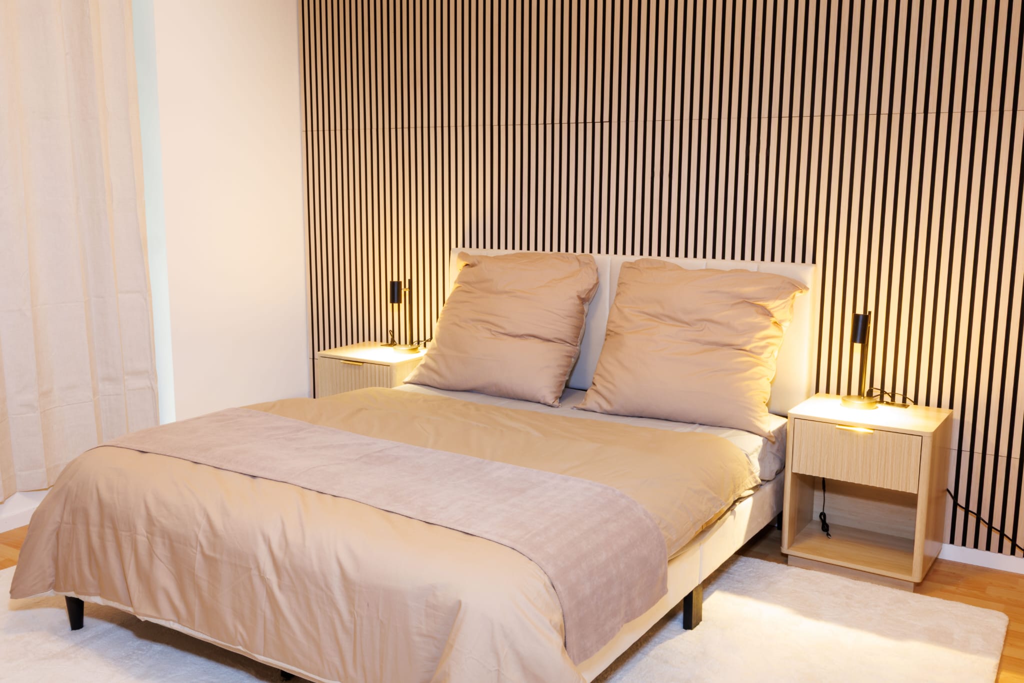 Comfortable double bed with warm bedside lighting